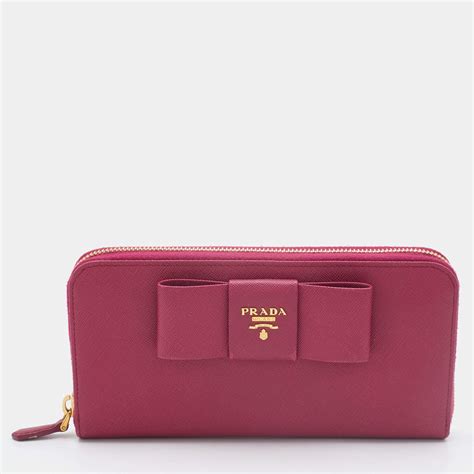 prada saffiano bow continental wallet pink|More.